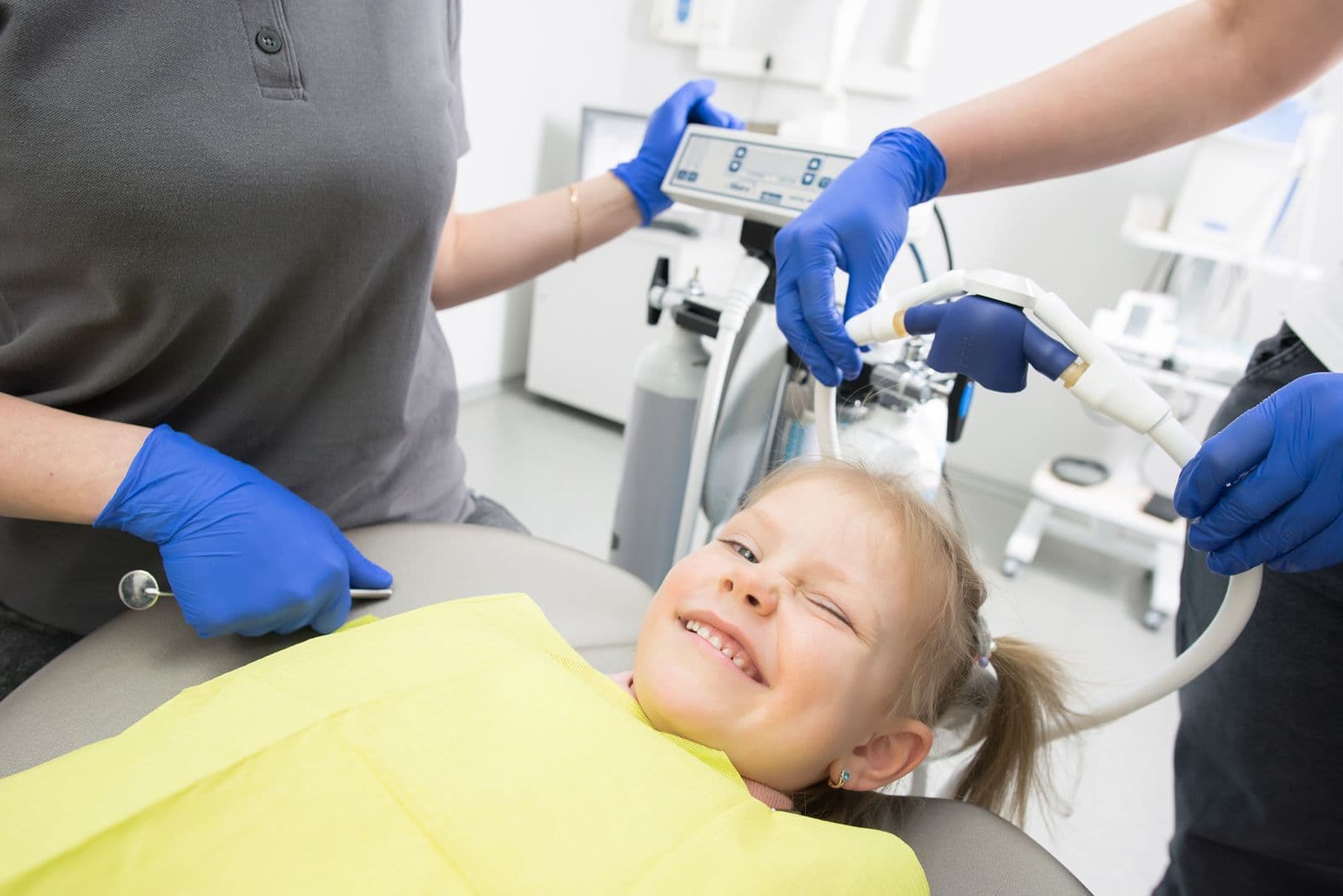 Young girl smiling during a dental check-up